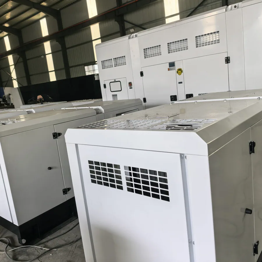 White sound-attenuated diesel generator canopies lined up at the plant